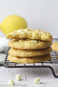 Stack of lemon zucchini cookies on a cooling rack.