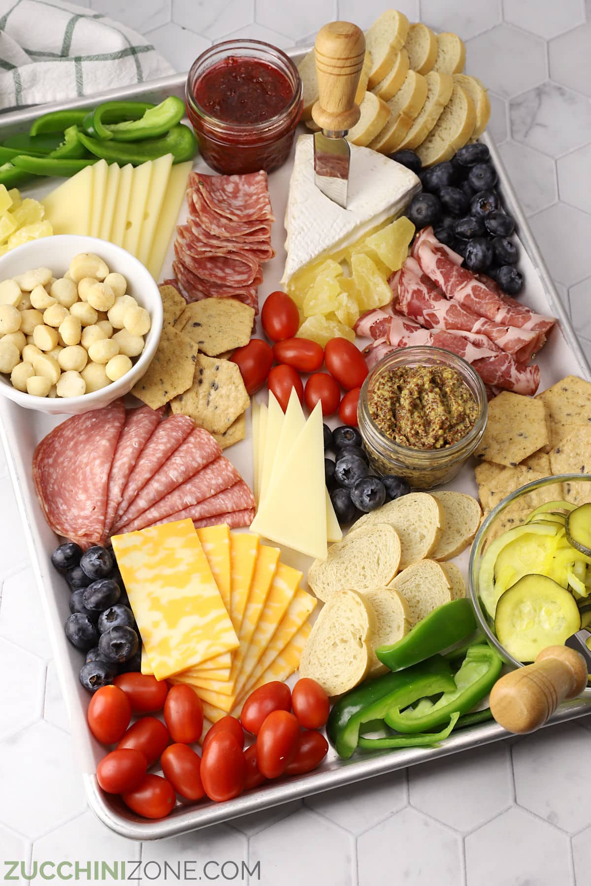 Closeup of a summer charcuterie board on a sheet pan.