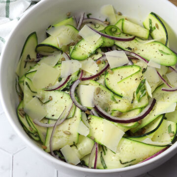 Serving bowl filled with zucchini ribbon salad.