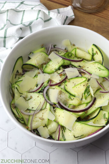 Serving bowl filled with zucchini ribbon salad.