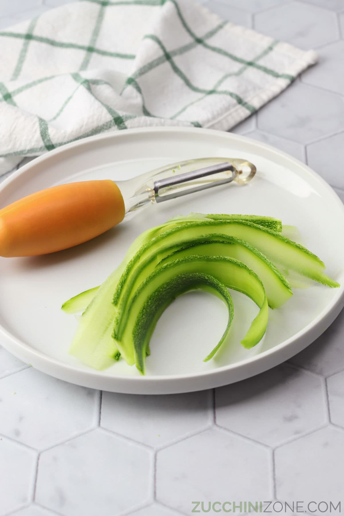 https://zucchinizone.com/wp-content/uploads/2023/06/zucchini-noodles-made-with-vegetable-peeler.jpg