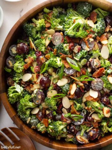 A wooden bowl of broccoli salad.