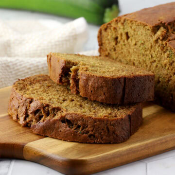 Slices of zucchini bread on a cutting board.