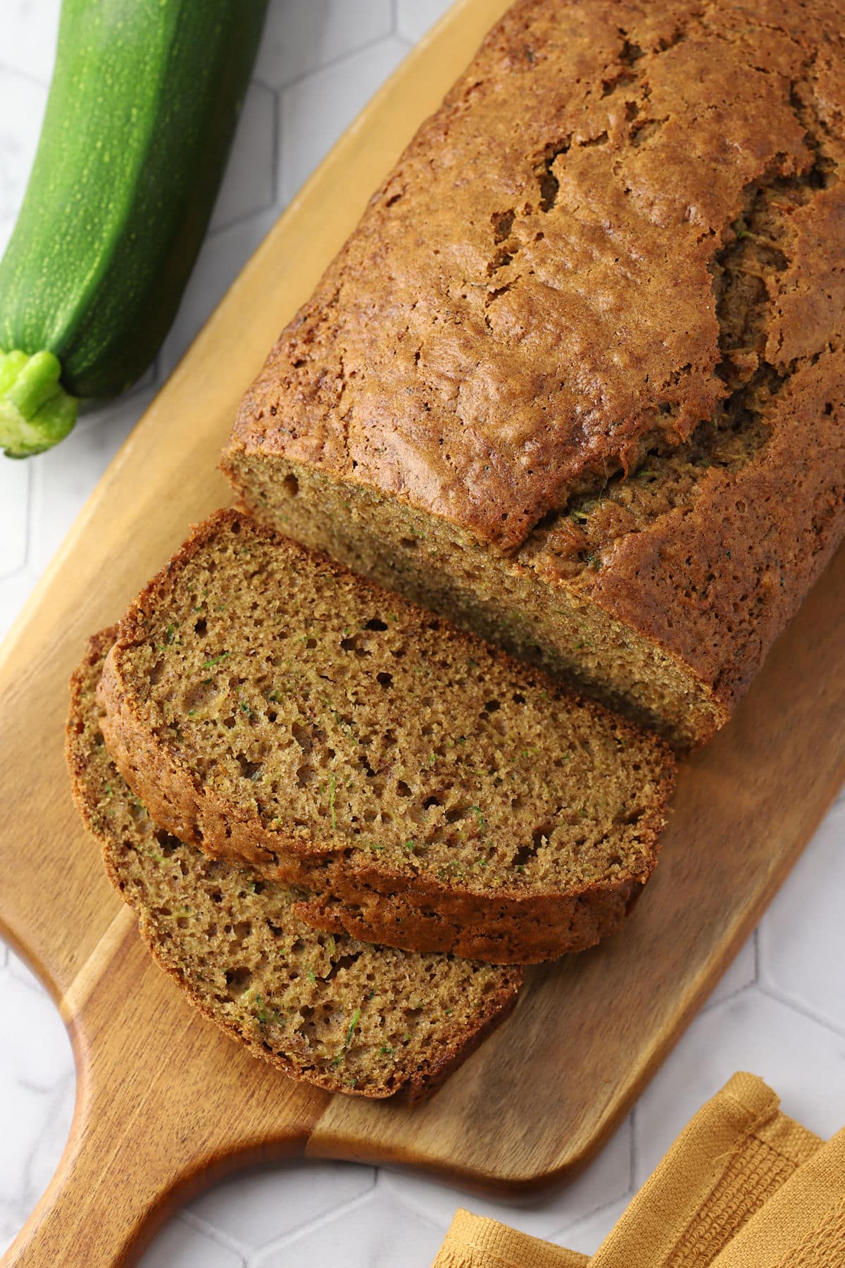 A sliced loaf of zucchini bread.