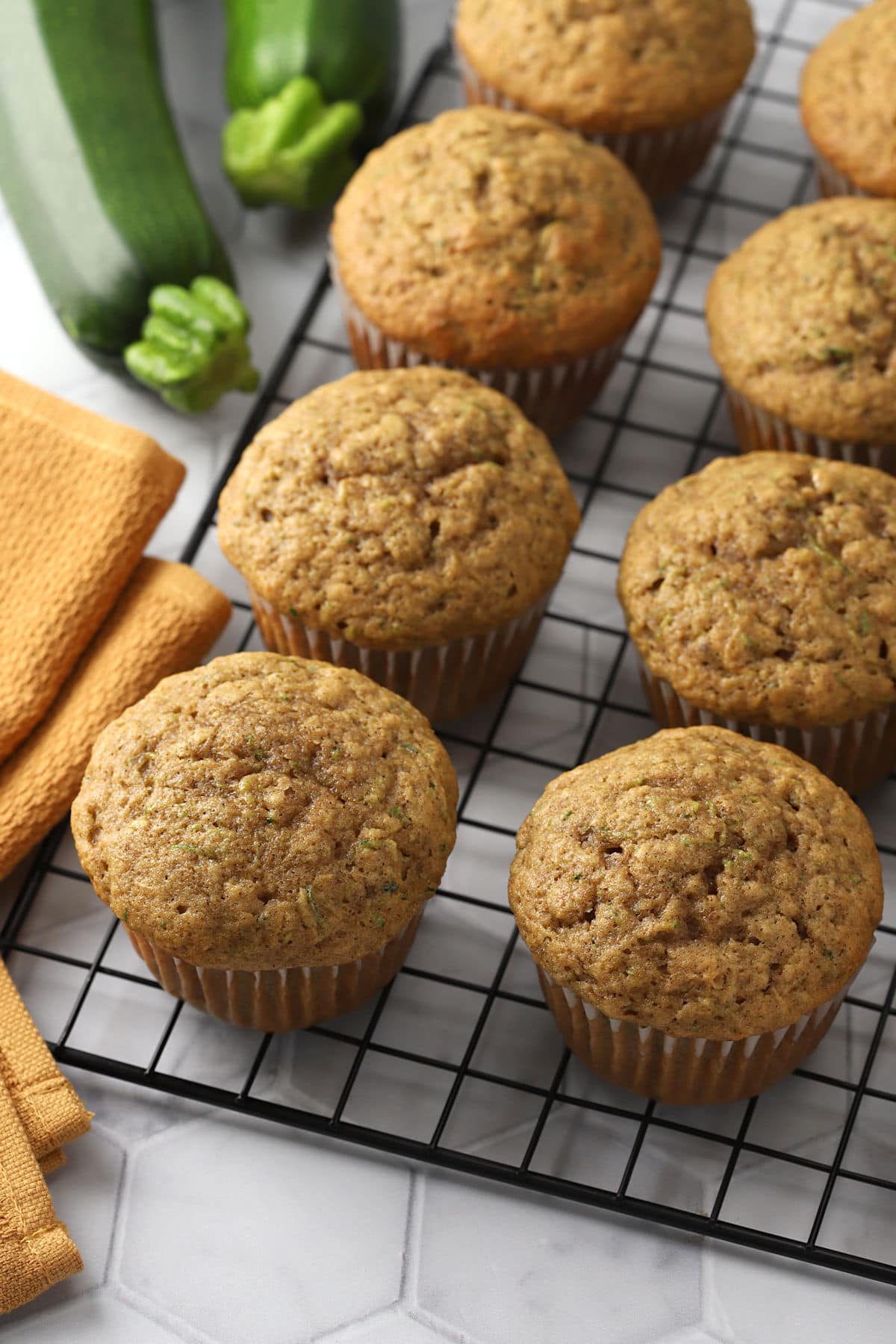 Zucchini muffins on a cooling rack.