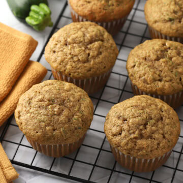Zucchini muffins on a cooling rack.