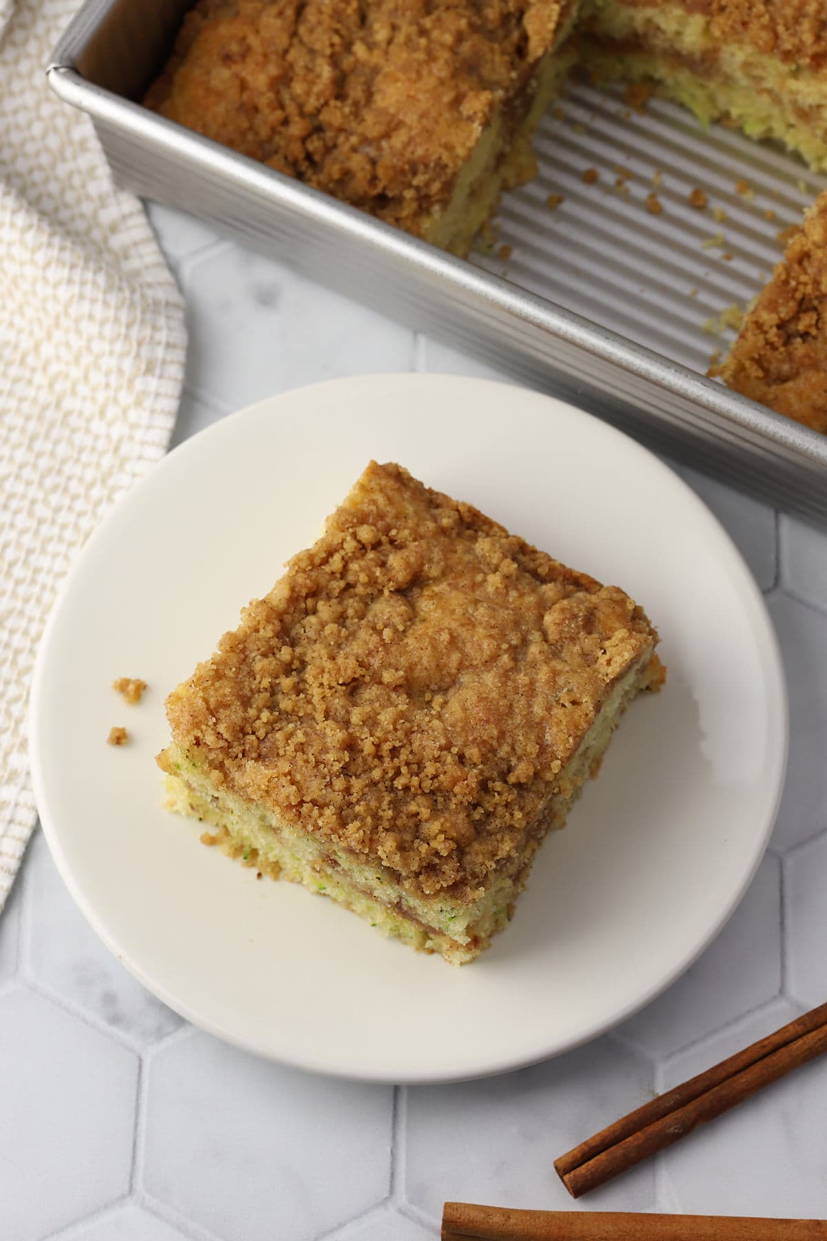 A slice of coffee cake with crumble on top.